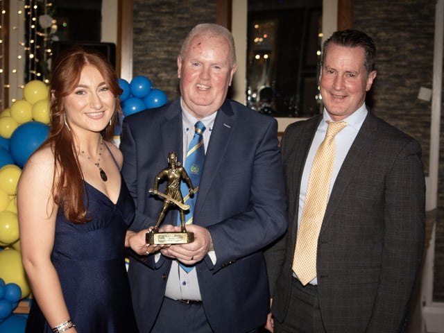 Tegan Duffy, Senior Camogie Young Player of the Year 2024, receives her trophy from Liam Gallagher, Club Chair. On right is Mr. Cormac Hartnett, County Board Hurling Officer . (Photos: Jim McCafferty Photography)