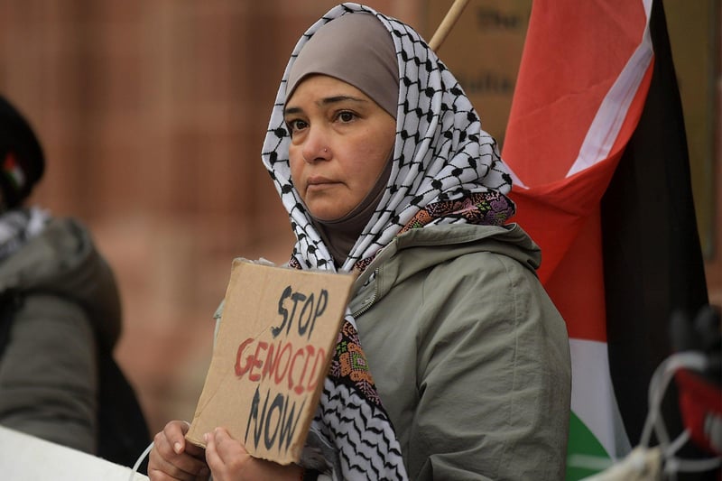 Protestor with placard during a rally in Guildhall Square, on Saturday afternoon, calling for a ceasefire in Gaza. Photo: George Sweeney