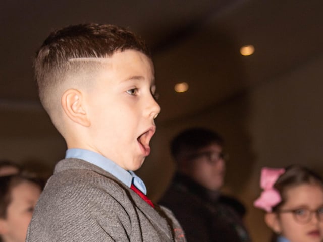 One of the young members of the school choir performing on Wednesday.