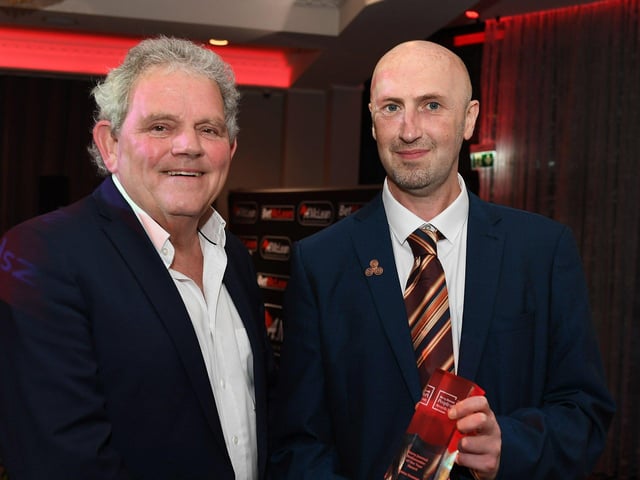 Brendan McDaid, editor of the Derry Journal, receives the Derry Journal Ambassador of the Year Award on behalf of winner Roma Downey from compere Adrian Logan. Photo: George Sweeney