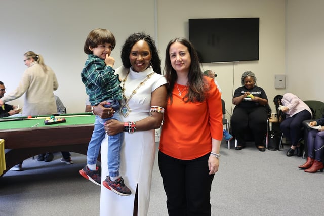 Mayor Barr with volunteer Rula Omar and her son Adam.