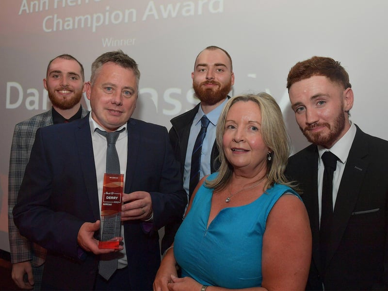 Sean Carlin accepts the Ann Herron Community Champion Award, on behalf of Sean Dolan’s Danny Cassidy, from Apex Chief Executive Shenna McCallion and Ann’s sons. Photo: George Sweeney. DER2325GS – 44