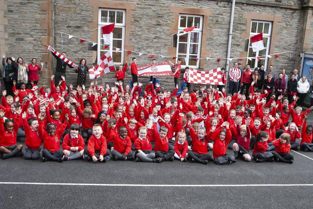 COME ON THE CANDYSTRIPES!. . . . .St. Eugene’s PS show their support for Derry City FC in their quest for FAI Cup honours this Sunday, when players Declan Glass and Cameron McJannet paid a visit.