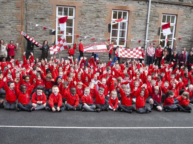 COME ON THE CANDYSTRIPES!. . . . .St. Eugene’s PS show their support for Derry City FC in their quest for FAI Cup honours this Sunday, when players Declan Glass and Cameron McJannet paid a visit.