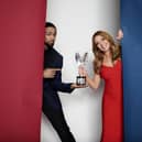 Hosts Carol Vorderman (right) and Ashley Banjo holding one of the Pride Of Britain Awards