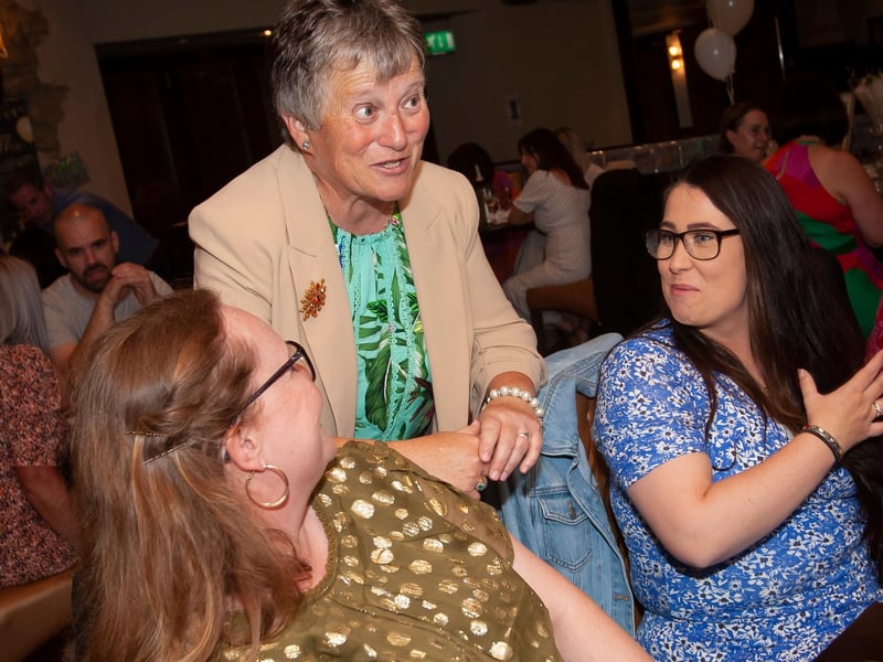 Ms. Linda Heaney in conversation with some colleagues during her retirement function.