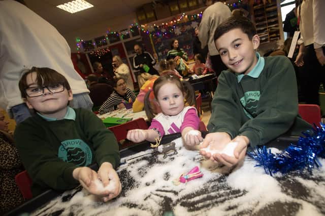 Having a ball with the snow is Ms. Freyja Gibson aided by Oakgrove P7 pupils Harley Grimsey and Mortan Feely. : .