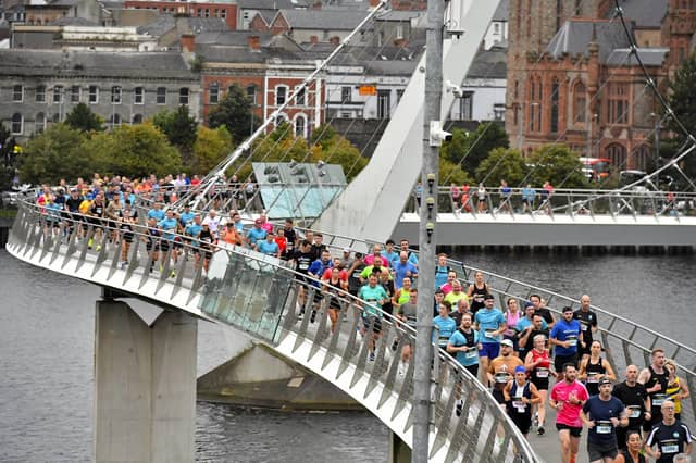 Competitors in the Waterside Half Marathon make their way over the Peace Bridge. Photo: George Sweeney