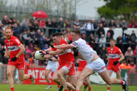 Derry’s Gareth McKinless charges past Tyrone’s Brian Kennedy during the Ulster Championship clash last May.  Photo: George Sweeney.  DER2218GS – 002