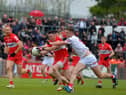 Derry’s Gareth McKinless charges past Tyrone’s Brian Kennedy during the Ulster Championship clash last May.  Photo: George Sweeney.  DER2218GS – 002