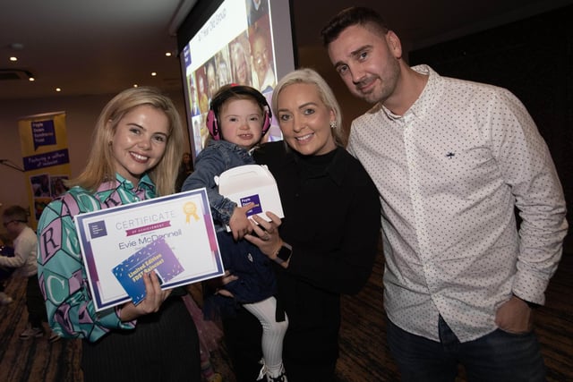 Little Evie McDonnell eceiving her award from Saoirse Monica Jackson of Derry Girls fame at the Foyle Down Syndrome Trust's Annual Night of Celebration at the Waterfoot Hotel last week. (Photos: Jim McCafferty Photography)