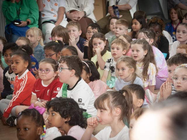 Pupils listen intently as Mrs. Ramsey says her goodbyes on Friday last at Model PS.