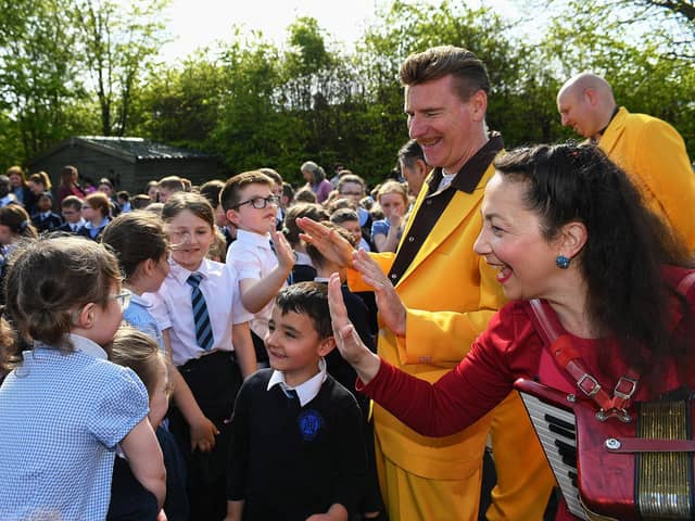 Pupils greet members of the Jive Aces at Rosemount Primary School during the Jazz Festival. Photo: George Sweeney