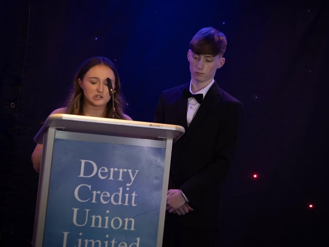 Lauren McBrearty and Cian McLaughlin, Youth Committee, Derry Credit Union, addressing the attendance at the Young People's Awards, 2025 on Monday night last.