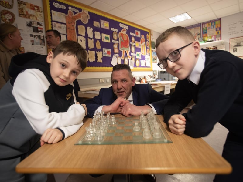 CHECKMATE!. . . .Mr. Smith adjudicates during this chess match between Eli Jordan (St. Anne's PS) and Conor Glackin (Rosemount PS) on Tuesday night.