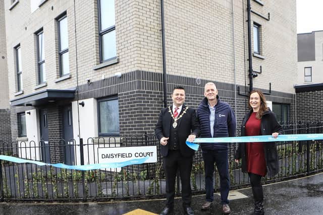 Mayor Ruairí McHugh cutting the ribbon to official open the new Radius / Geda social housing development “Daisyfield Court”, Foyle Road. Included are Denise Quinn, senior head of development, Radius Housing and Damian Murray, construction partner Geda. (Photo - Tom Heaney, nwpresspics)