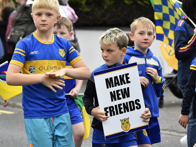 Muff Feile opening parade makes its way through the village on Friday evening. Photo: George Sweeney