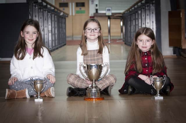 Three very happy young prizewinners at Sunday’s Charity Feis in the Millennium Forum. (Photos: Jim McCafferty Photography)