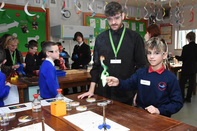 A pupil from St. Oliver Plunkett attempting a science experiment at St. Joseph’s Boys' School on Friday.