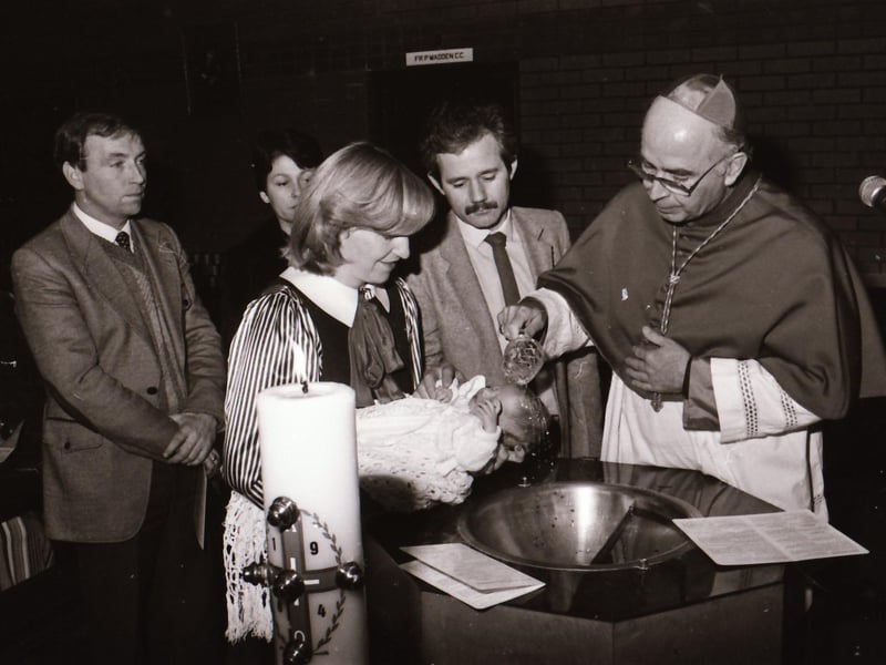 Bishop Daly with newly baptised infants at Holy Family Church during pastoral visitation to Ballymagroarty.