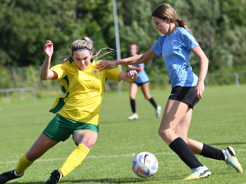 Donegal Women's League defender Scarlett Keys dives in to tackle Surf Select (USA) player Sierra Hitchcock. (Photo: Keith Moore)