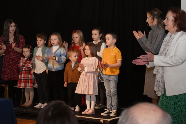 The very young singers from the MacCafferty school performing in a warm-up sing along before singing their individual songs.