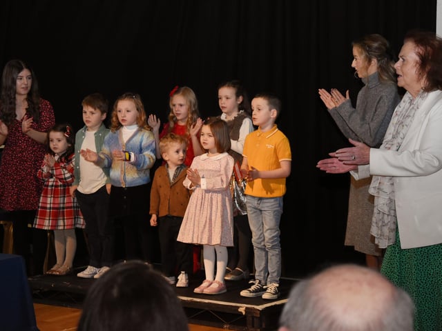 The very young singers from the MacCafferty school performing in a warm-up sing along before singing their individual songs.