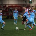 Institute’s Orin McLaughlin and Caoimhin tackle Derry City’s Patrick McEleney. Photograph: George Sweeney.