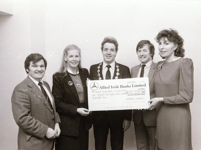 Cheque from Aerobics session to Mayor for Rebelle 37.
