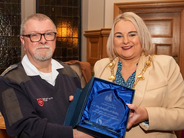 The Mayor Councillor Sandra Duffy welcomed members of the Order of Malta to the Guildhall where she presented, Charlie Glenn from the organisation with commemorative crystal in recognition of their contribution across the Derry City and Strabane District Council area. Picture Martin McKeown. 06.02.23:Mayor of Derry City and Strabane District Council’s reception for Knights of Malta in the Mayor’s Parlour, Guildhall on Monday 6th February.