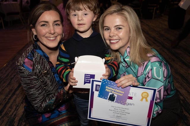 Finn receives his award from Saoirse Monica Jackson on Tuesday evening last at the Waterfoot Hotel.