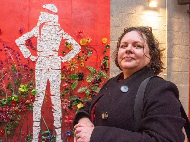 Deirdre McCrory with her mural of Ameilia Earhart made from recycled materials including polished oyster shells which features in The Taproom at the Walled City Brewery. Picture Martin McKeown. 20.10.22