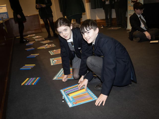 Lumen Christi students Molly O'Donnell and Ben O'Donnell hard at work during Friday's Maths Fest event. : .