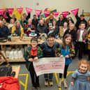 Caroline McGuinness-Brooks, front centre, with others celebrating the funding award. Photo: Martin McKeown.