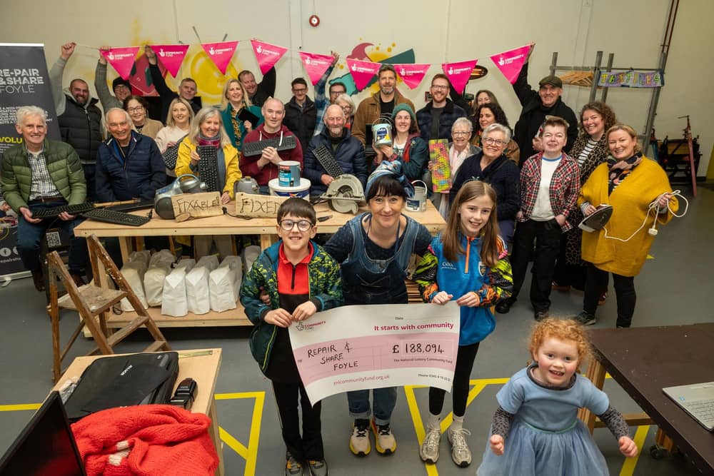 Caroline McGuinness-Brooks, front centre, with others celebrating the funding award. Photo: Martin McKeown.