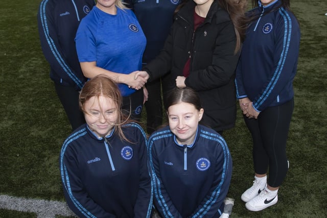 Mrs. Jennie Martin, Head of PE, St. Mary’s College welcoming Lauren Curran, Ballymagroarty/Hazelbank Community Partnership, sponsors of the Primary Schools Duathlon on Wednesday at the school. Included are some of the students who helped organise the day’s event.
