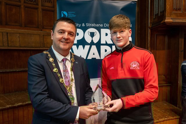 The Mayor, Councillor Ruairí McHugh, presents Michael McGlynn, Strabane Shotokan Karate Club, with the 'Young Male Sports Star of the Year' award  as he hosted the annual Derry City and Strabane District Council Sports Awards in the Guildhall. Picture Martin McKeown. 05.06.25