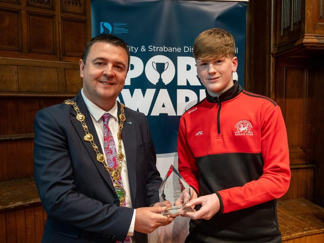 The Mayor, Councillor Ruairí McHugh, presents Michael McGlynn, Strabane Shotokan Karate Club, with the 'Young Male Sports Star of the Year' award as he hosted the annual Derry City and Strabane District Council Sports Awards in the Guildhall. Picture Martin McKeown. 05.06.25