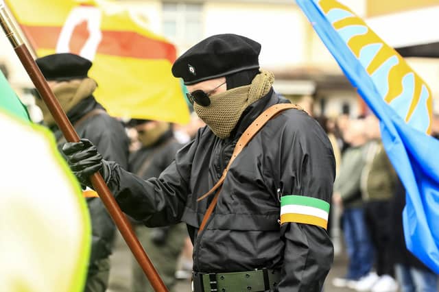 Members of the Colour Party lower the flags as a salute to dead comrades at the Creggan Republican monument as they take part in the Saoradh Easter Commemoration leaving Creggan Shop to City Cemetery. (Photo - Tom Heaney, nwpresspics)