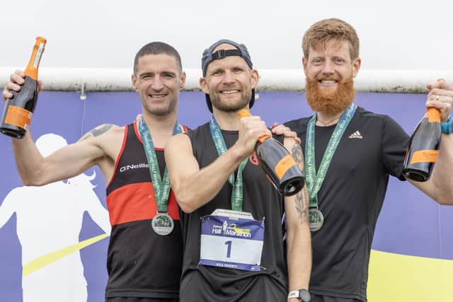 Kyle Doherty (centre), winner of this year's Strabane Lifford Half Marathon with runners up Martin Lynch (Milford AC) and Shane Donnelly (Strive).  (North West Newspix)