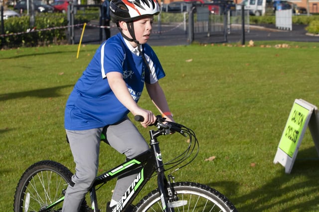 One of the young cyclists negotiates the terrain at the start of the cycle leg of Wednesday’s Primary Schools Duathlon at St. Mary’s College.