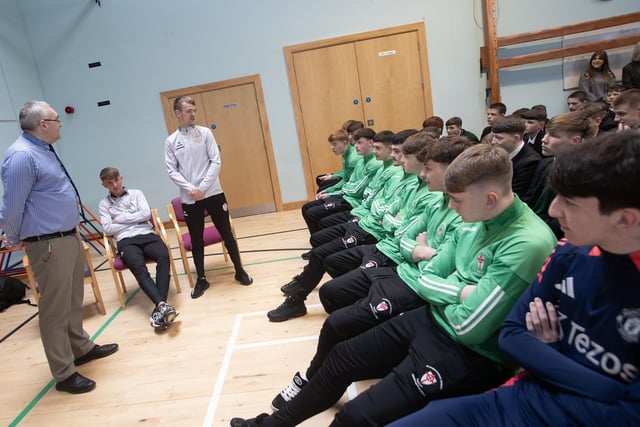 Derry City players Ciaron Harkin and Glenn McCourt speak to the St Joseph's Boys NI cup winning team and pupils.