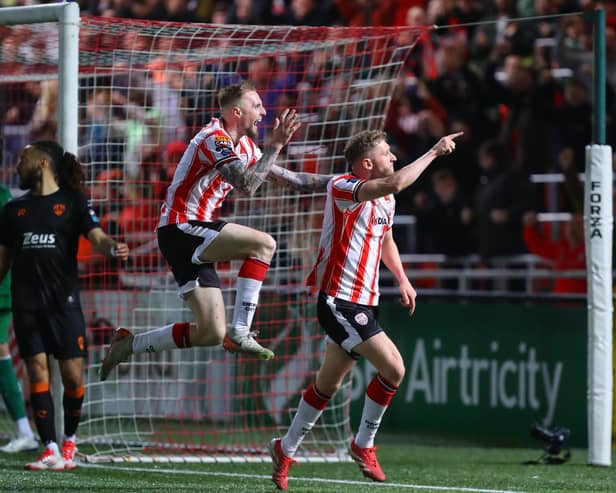 Ronan Boyce and Carl Winchester celebrate after the Ramelton man's bicycle kick in front of the North Stand against Cork City.
