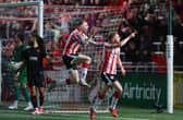 Ronan Boyce and Carl Winchester celebrate after the Ramelton man's bicycle kick in front of the North Stand against Cork City.