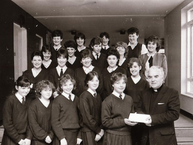 St Cecilia's presentation of a cheque for the disabled to Fr George McLaughlin.