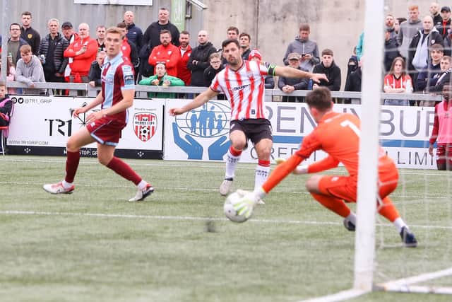 Derry City striker Pat Hoban tries his luck from distance.
