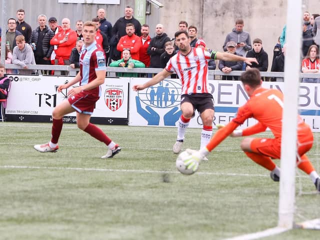 Derry City striker Pat Hoban tries his luck from distance.
