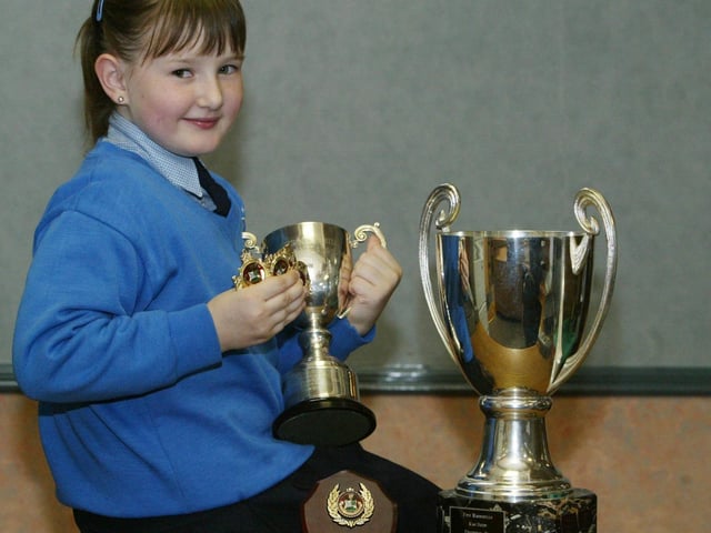 Clodagh Kennedy of Cashelmore park, Derry who won several competition at the recnt Moville Feis. Clodagh was the winner of the Peggy McLaughlin Cup for singing under 10, the MacBride Cup for piano under 10, the violin under 10, piano interpretation under 13 and the ensemble singing. Clodagh is a student of the McGinley and McCaferty schools of music. (0705JB42):Winners at the Moville Feis in 2004.:Moville Feis 2004