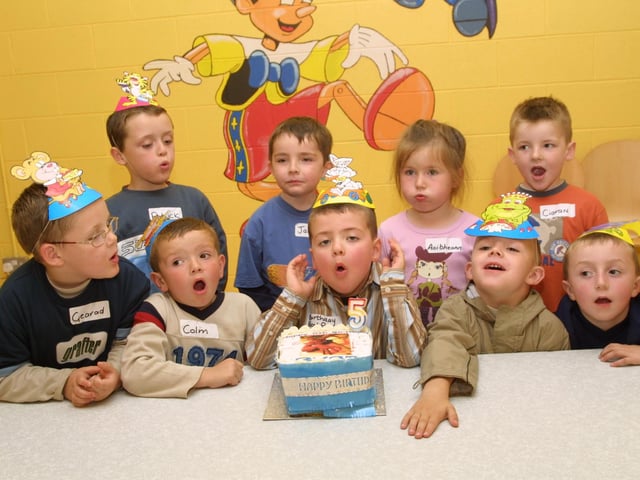 Ryan blows out his candles with a little help from his friends.