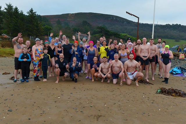 Swimmers who participated in the annual ARC Fitness New Year's Day Charity Swim at Lisfannon beach.  Photo: George Sweeney. DER2301GS  01